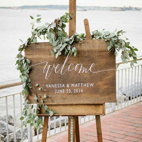wedding sign with eucalyptus garland accent