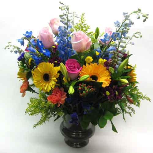 garden style flower arrangement with delphinium